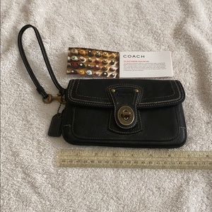 New black textured leather Coach wristlet